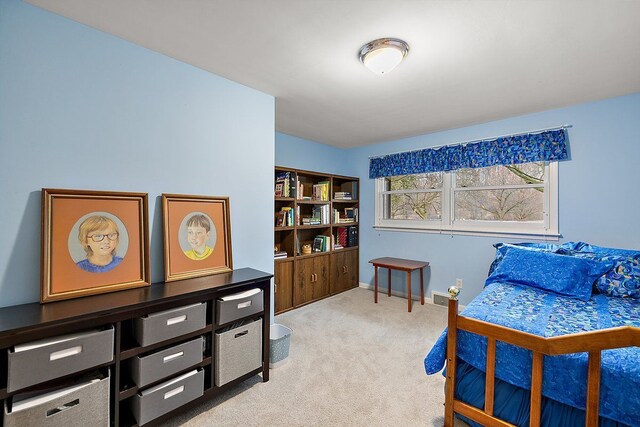 bedroom with baseboards and carpet floors