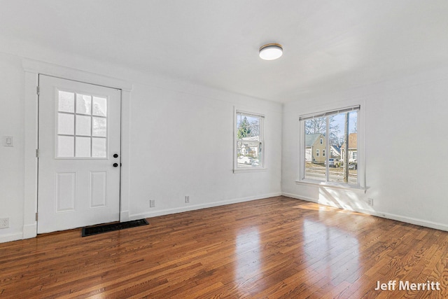 entrance foyer with hardwood / wood-style flooring and baseboards