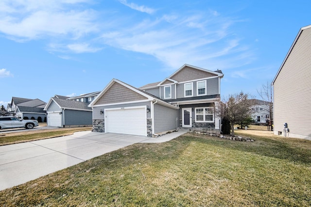 view of front of property featuring a front lawn, stone siding, a garage, and driveway