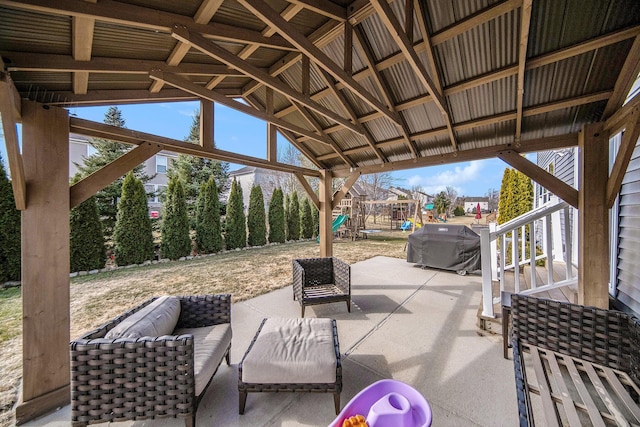 view of patio / terrace featuring area for grilling, outdoor lounge area, and a playground