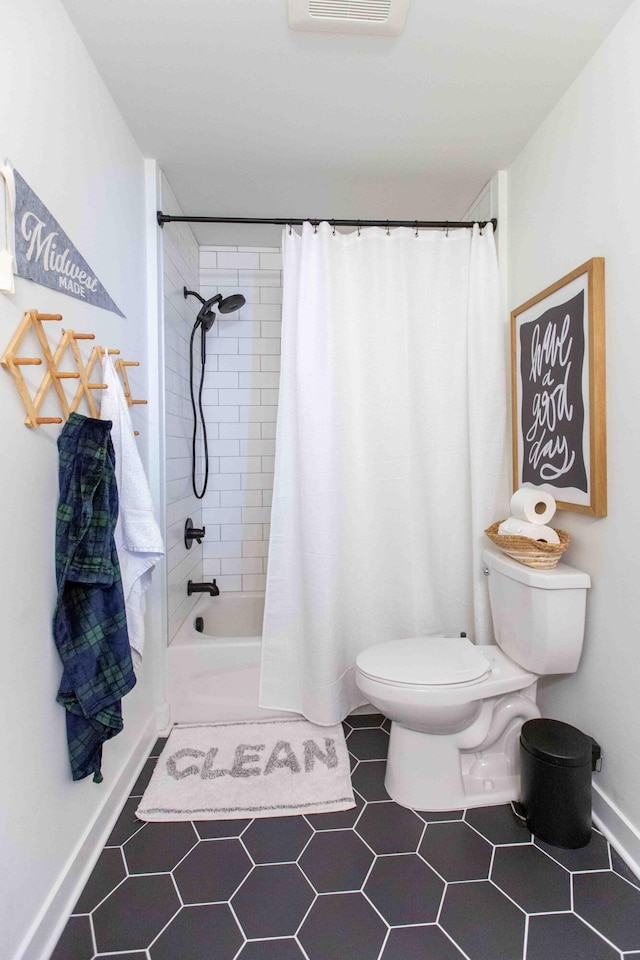 full bathroom with visible vents, toilet, and shower / bath combo