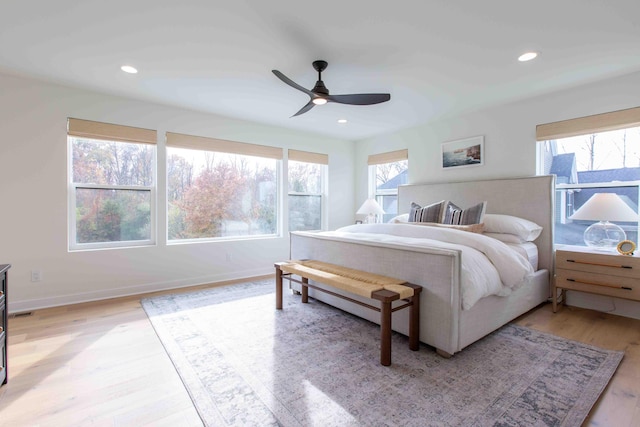 bedroom with a ceiling fan, recessed lighting, baseboards, and light wood finished floors