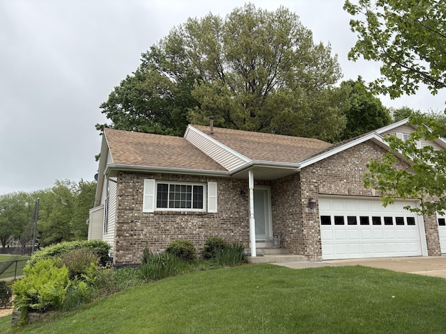 433 Amity St Unit 3, Douglas, MI 49406 - ranch-style house featuring brick siding, a front yard, an attached garage, a shingled roof, and concrete driveway