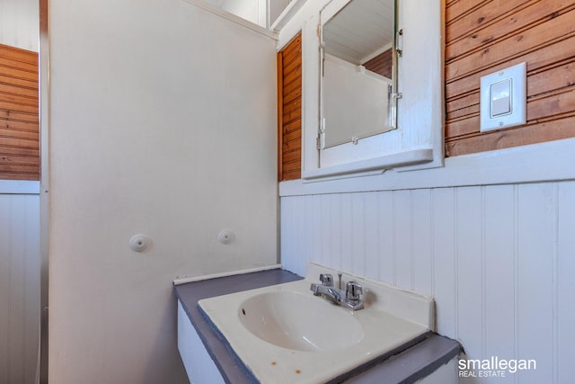 bathroom featuring vanity and wainscoting