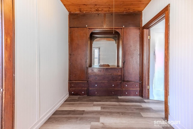 hall with wood ceiling and wood finished floors