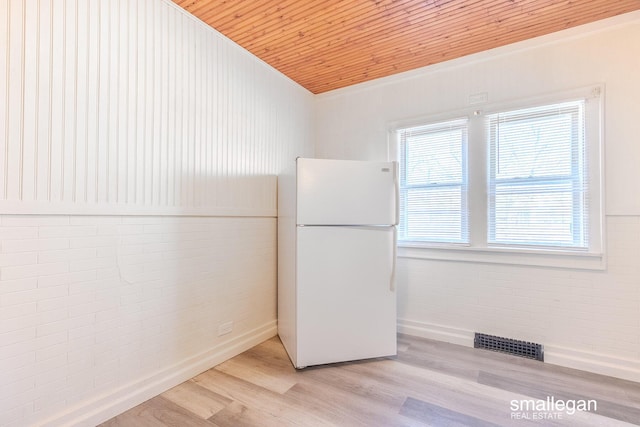 interior space featuring visible vents, wooden ceiling, and light wood finished floors