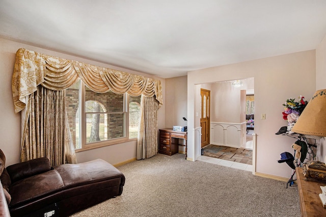 sitting room with carpet and baseboards