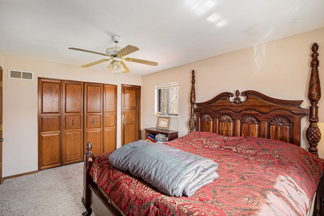 bedroom with light carpet, visible vents, baseboards, and a ceiling fan