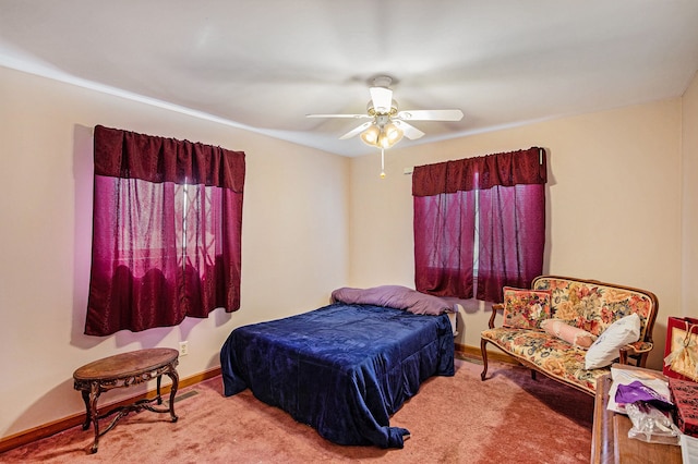 bedroom featuring ceiling fan, baseboards, and carpet floors