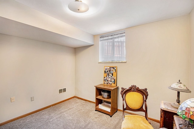 interior space with carpet flooring, baseboards, and visible vents