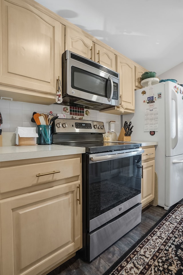 kitchen with light countertops, tasteful backsplash, and stainless steel appliances