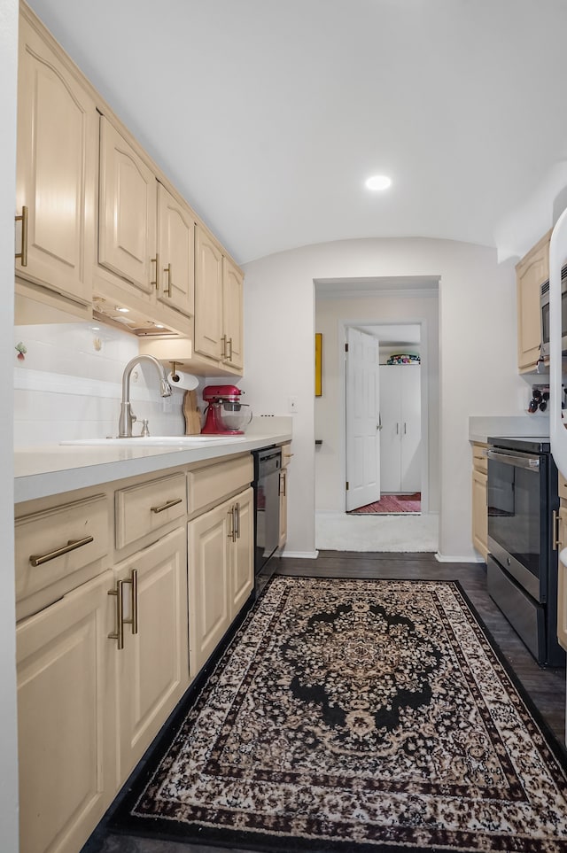 kitchen with dishwasher, stainless steel electric range oven, light countertops, and baseboards