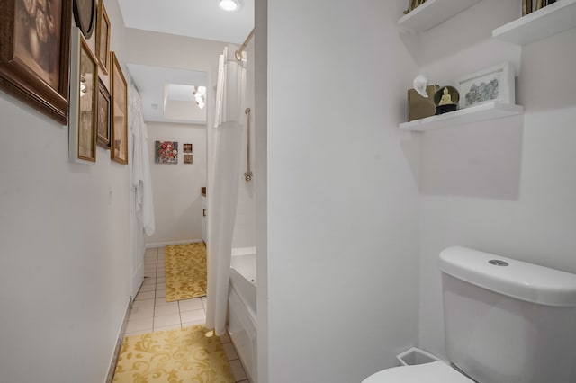 full bath featuring tile patterned flooring, a shower with shower curtain, and toilet