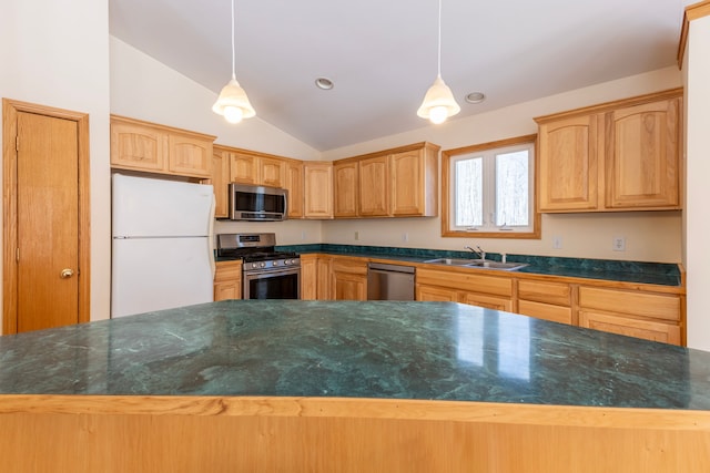 kitchen featuring a sink, decorative light fixtures, dark countertops, stainless steel appliances, and lofted ceiling