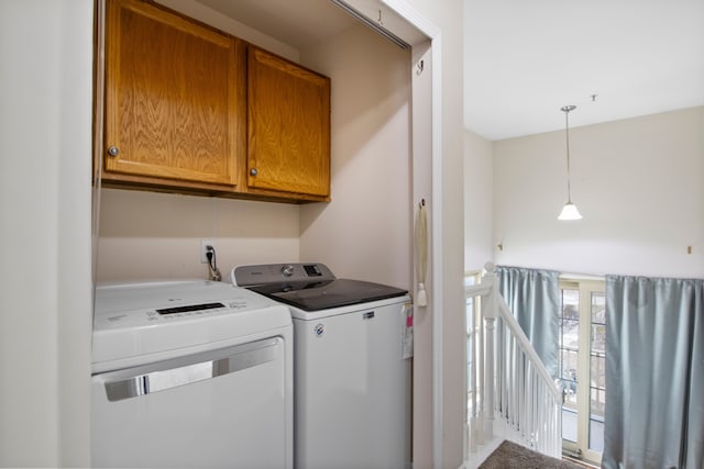 laundry room featuring cabinet space and separate washer and dryer