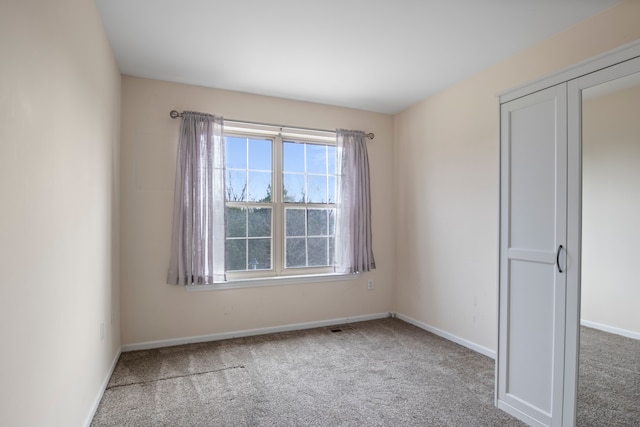 interior space with visible vents, baseboards, and carpet floors