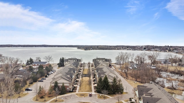 birds eye view of property with a water view