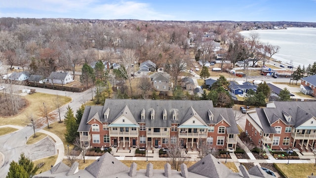 birds eye view of property featuring a residential view and a water view