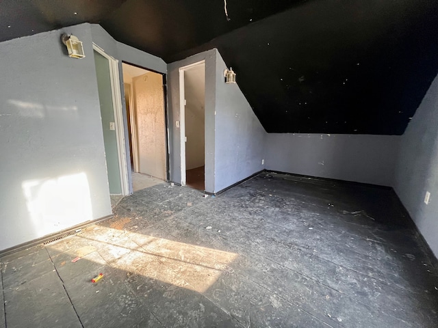 bonus room featuring lofted ceiling