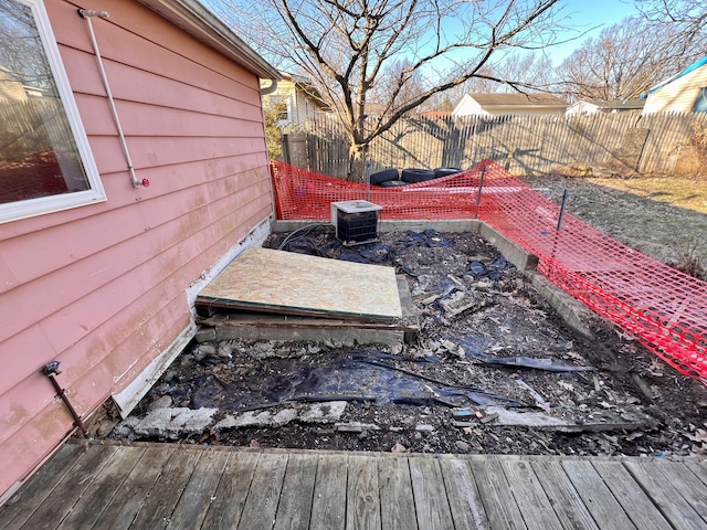 exterior space featuring cooling unit and fence