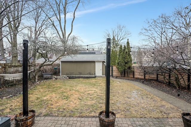 view of yard featuring an outbuilding and a fenced backyard