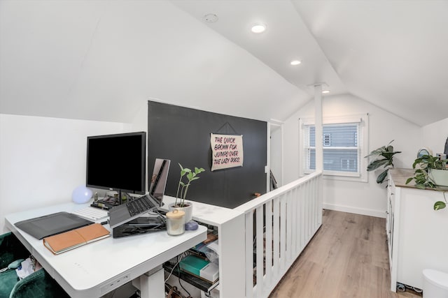 office space with recessed lighting, baseboards, light wood-style flooring, and vaulted ceiling