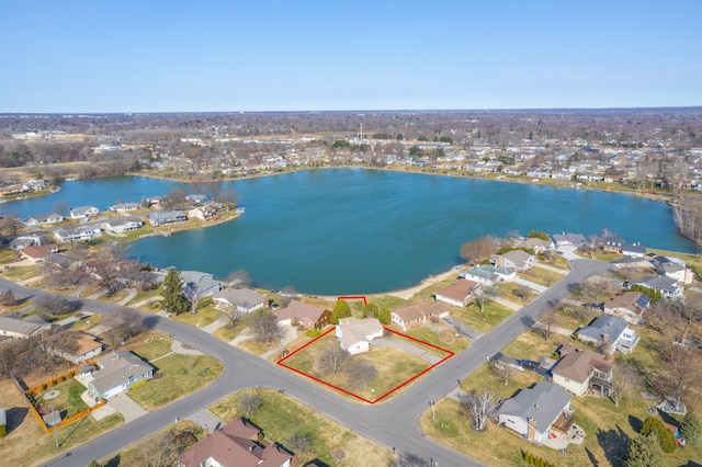 drone / aerial view featuring a residential view and a water view