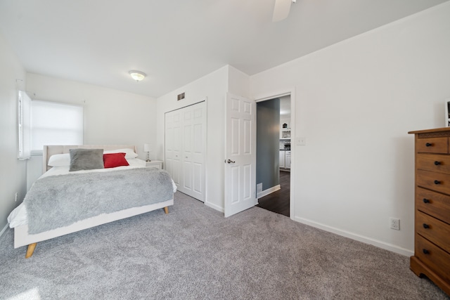 bedroom with a ceiling fan, baseboards, visible vents, carpet floors, and a closet