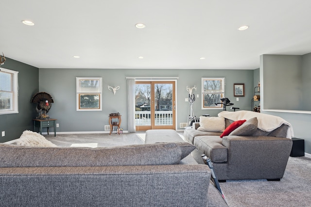 carpeted living room featuring recessed lighting and baseboards