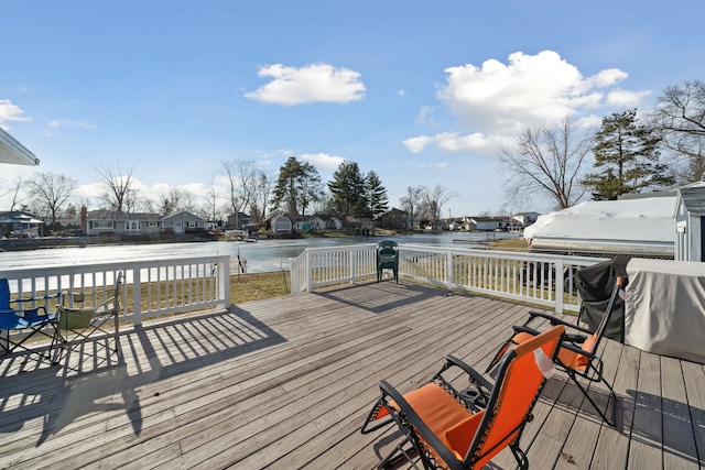 wooden deck featuring a water view