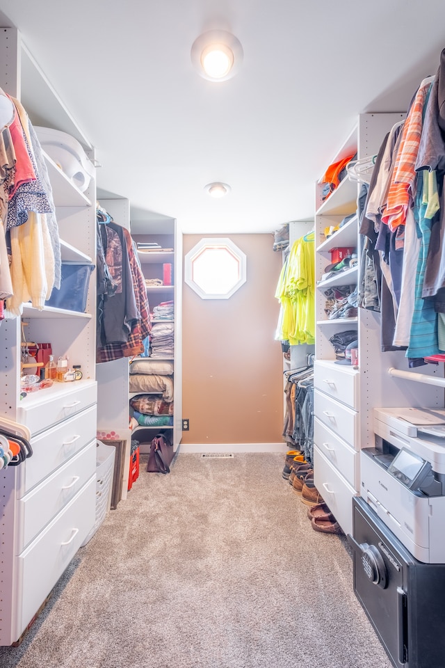 spacious closet featuring carpet floors