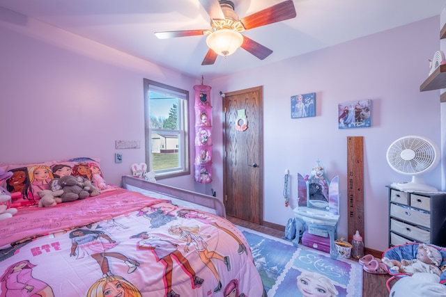 bedroom featuring a closet, a ceiling fan, and wood finished floors