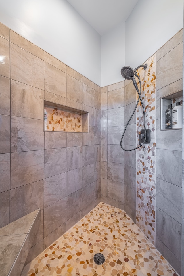 bathroom with tiled shower