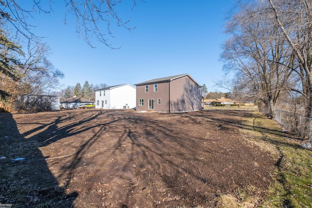 back of house featuring fence