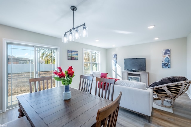 dining area with recessed lighting and light wood-style flooring