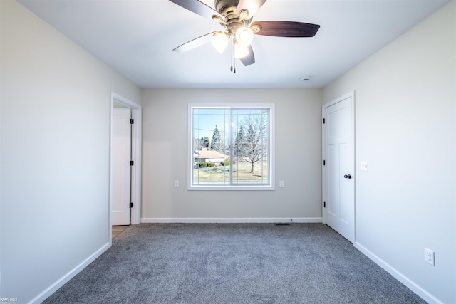 unfurnished bedroom with a ceiling fan, baseboards, and carpet floors