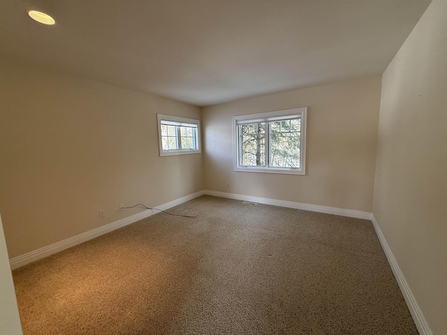 empty room featuring baseboards