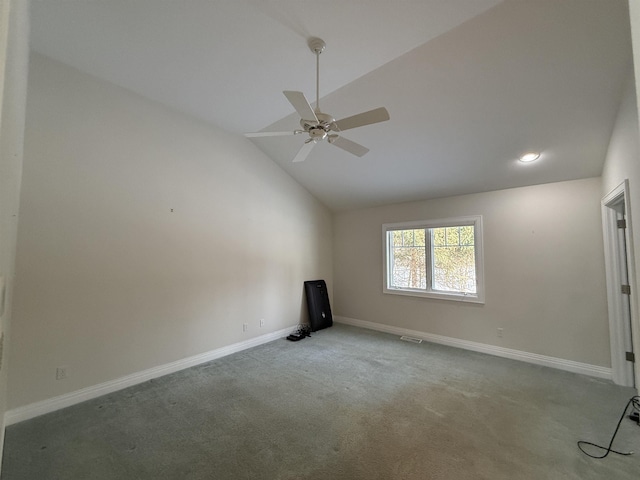 carpeted spare room with visible vents, baseboards, lofted ceiling, and ceiling fan