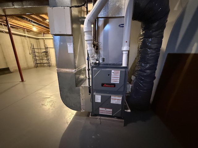 utility room featuring heating unit