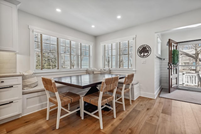 dining area featuring light wood-style flooring, recessed lighting, baseboards, and breakfast area