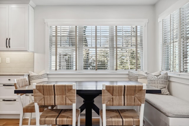 dining room featuring wood finished floors and breakfast area