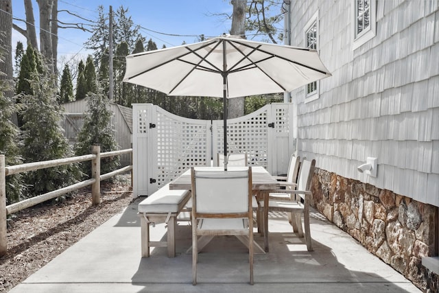 view of patio / terrace with outdoor dining area and fence