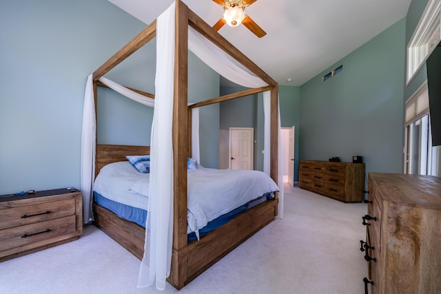 carpeted bedroom with visible vents and ceiling fan