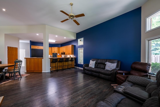 living area featuring ceiling fan, baseboards, dark wood-style floors, and recessed lighting