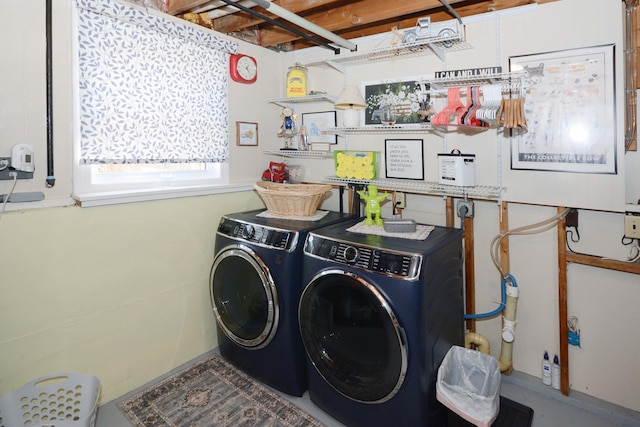 washroom featuring washing machine and dryer and laundry area