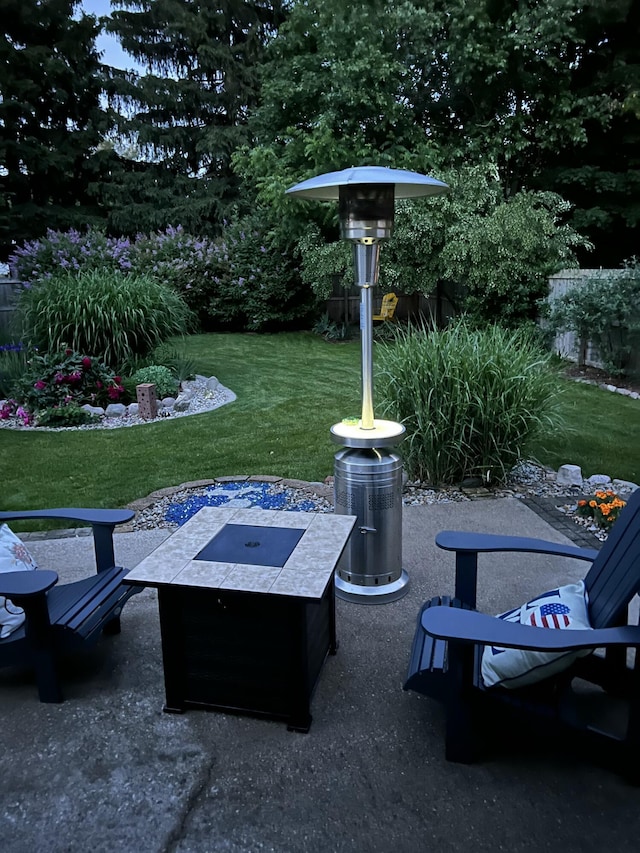 view of yard with a patio and an outdoor fire pit