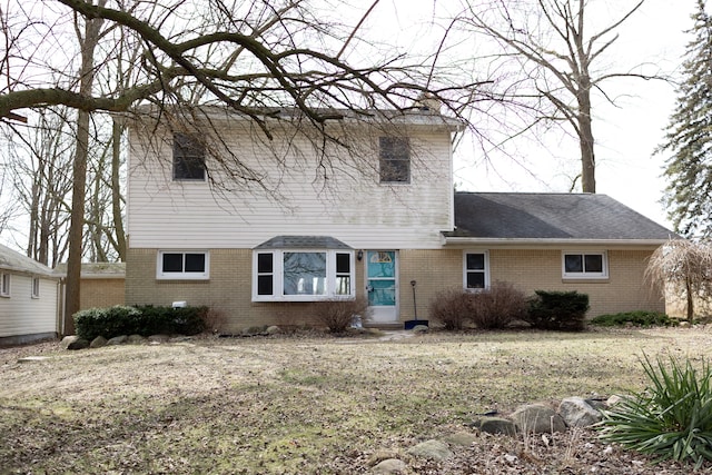 view of front of house featuring brick siding