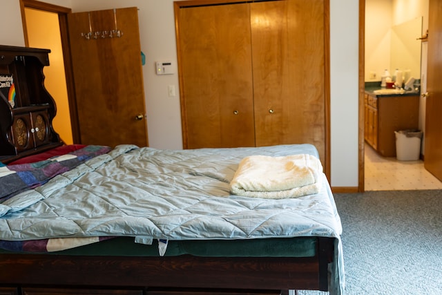 bedroom featuring a closet and carpet floors