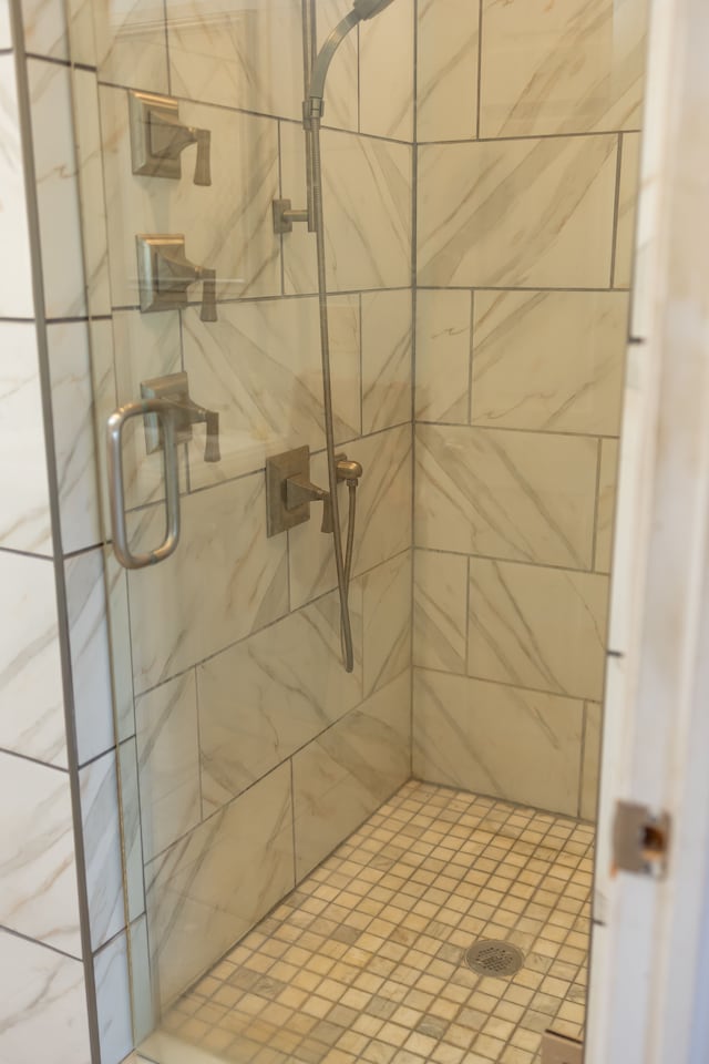 bathroom with a shower stall