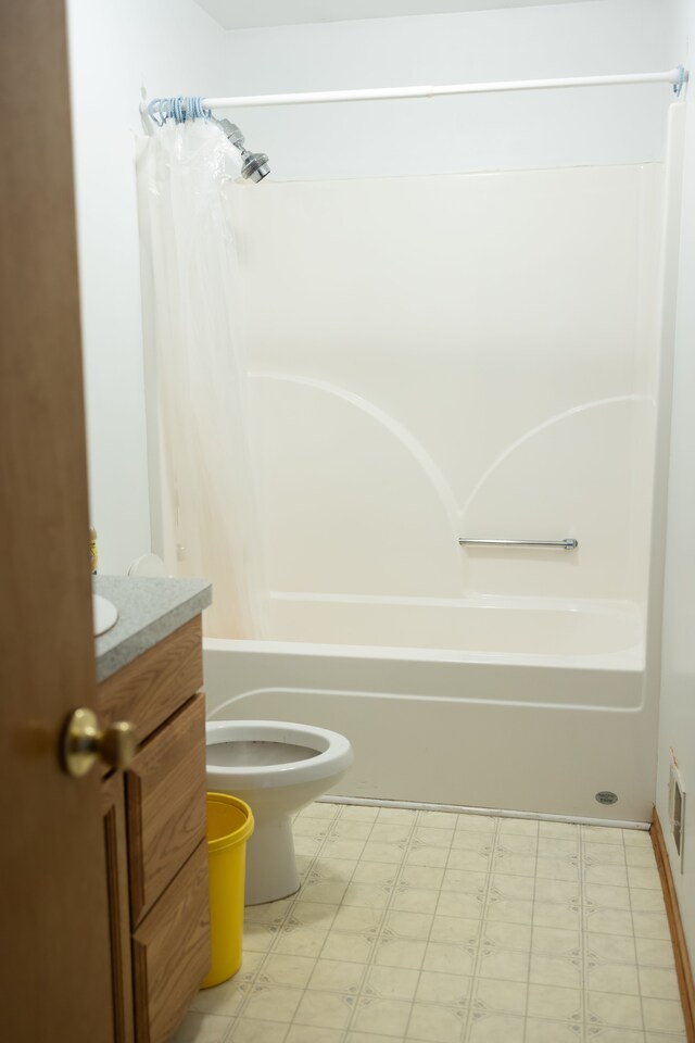 bathroom featuring vanity, visible vents, shower / bath combo, tile patterned floors, and toilet